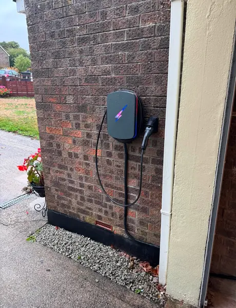 Home EV charger installation in Falmouth on a brick wall